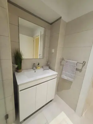 a bathroom with a white sink and a mirror at Casa Marcelino Refugio Frente Mar in Paul do Mar