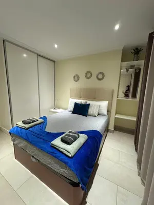 a bedroom with a large bed with towels on it at Casa Marcelino Refugio Frente Mar in Paul do Mar