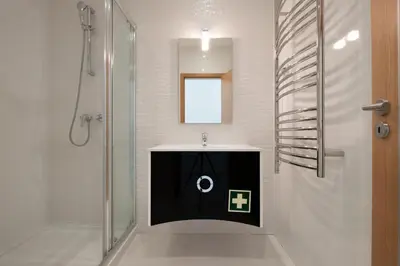 a bathroom with a sink and a shower at Porto de Mos 69 by Destination Algarve in Lagos