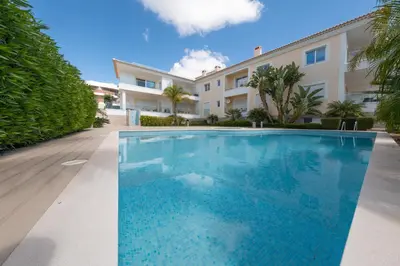 a large swimming pool in front of a building at Porto de Mos 69 by Destination Algarve in Lagos