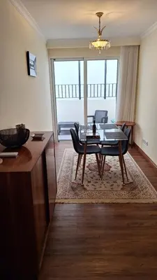 a living room with a table and a dining room at Theo's City House in Funchal