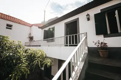 a white house with a staircase in front of it at Casa da Avo Rosa in São Vicente