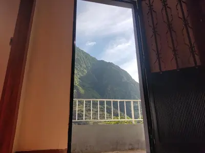 a window with a view of a mountain at Casa da Avo Rosa in São Vicente