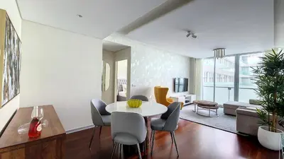 a living room with a white table and chairs at Upscale Apartment by LovelyStay in Funchal