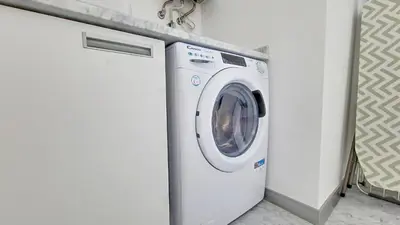 a white washing machine in a white laundry room at Upscale Apartment by LovelyStay in Funchal