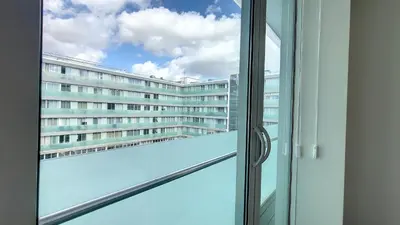 an open window with a view of a building at Upscale Apartment by LovelyStay in Funchal