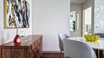a dining room with a table and two chairs at Upscale Apartment by LovelyStay in Funchal