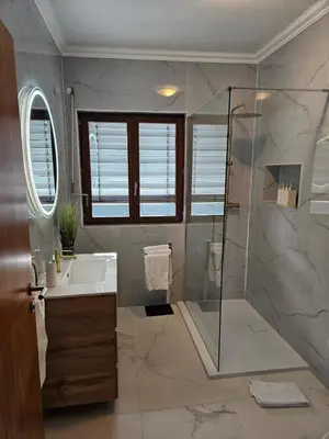 a bathroom with a shower and a sink at Studio no centro do Funchal in Funchal