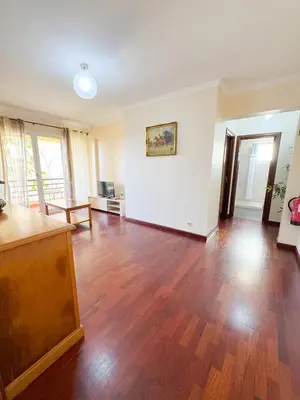 an empty living room with wooden floors and white walls at LIDO CASA BRANCA in Funchal