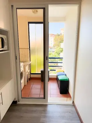 an open door to a bathroom with a toilet at LIDO CASA BRANCA in Funchal