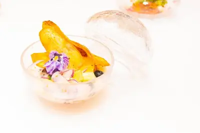 a bowl of food with a banana and other ingredients at BIO Hotel - Hotel Quinta da Serra in Estreito de Câmara de Lobos
