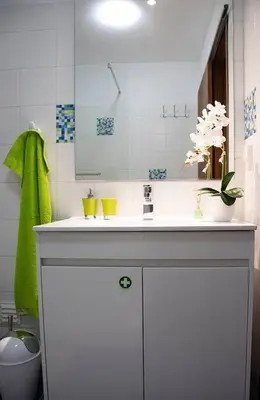 a bathroom with a white sink and a mirror at Funchal downtown 5min Marina + 2 bedroom + parking in Funchal