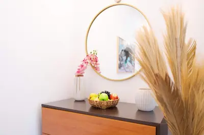 a bowl of fruit on a dresser with a mirror at Tropical Pearl by Atlantic Holiday in Funchal