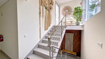 a staircase in a home with white walls and a stair case at Villa Obra-Prima by LovelyStay in Funchal