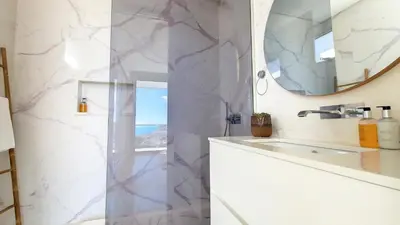 a bathroom with a sink and a mirror at Villa Obra-Prima by LovelyStay in Funchal