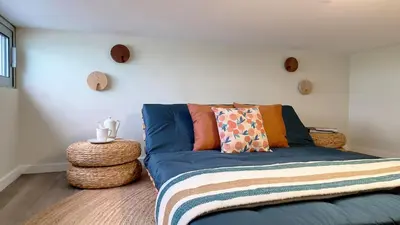 a living room with a blue couch in a room at Villa Obra-Prima by LovelyStay in Funchal