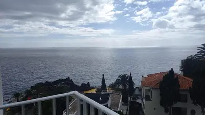 a view of the ocean from a balcony at Apartamentos do Mar - Pikis Flat in Funchal