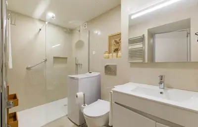 a bathroom with a toilet and a sink and a shower at Apartamentos do Mar - Pikis Flat in Funchal