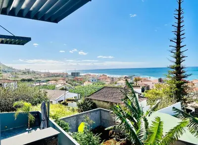 a view of the ocean from the balcony of a house at Haus am Meer by Your Madeira Rentals in Paul do Mar