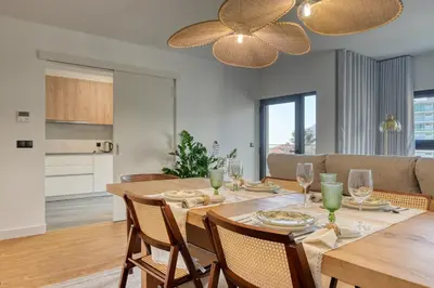 a dining room and kitchen with a table and chairs at São Lucas, a Home in Madeira in Funchal