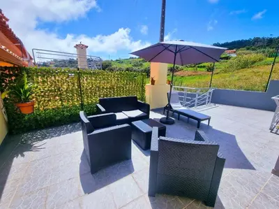 a view of an empty street with a yellow building at Near Levadas and Pico Ruivo, Santana Madeira Getaway with Terrace Views in Santana