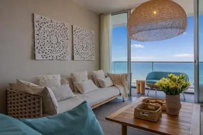 a living room with a couch and a table at FLH Madeira Palace Oceanfront Luxury in Funchal