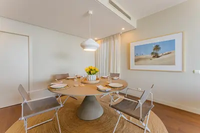 a dining room with a table and chairs at FLH Madeira Palace Oceanfront Luxury in Funchal