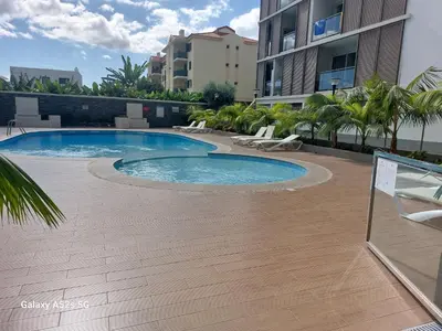 a swimming pool in the middle of a building at Highrise Madalenas Apartment in Funchal