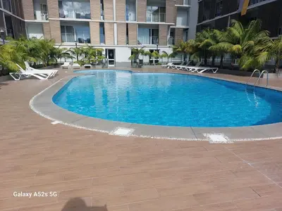 a large swimming pool in the middle of a building at Highrise Madalenas Apartment in Funchal