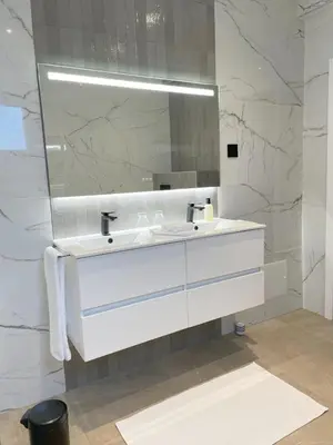 a bathroom with a white sink and a mirror at Casa do Mundo Madeira in Gaula
