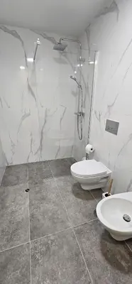 a bathroom with a shower and a toilet and a sink at Vista Mar The Place by Rentallido in Funchal