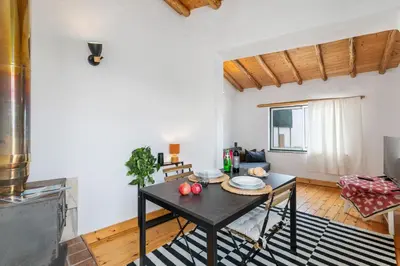 a living room with a table with apples on it at Da Casa Sesta in Sagres