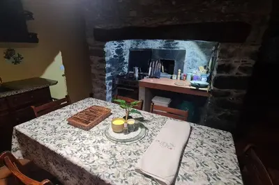 a kitchen with a table with a table cloth and a table sidx sidx sidx at Tranquilidade em Mar e Montanha in Arco da Calheta
