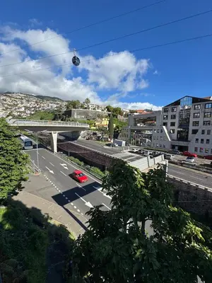 a kitchen with a washer and a sink and a stove at House in the Heart of Funchal with big balcony in Funchal
