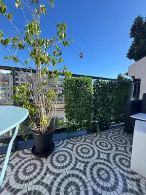 a kitchen with a table with a bowl of fruit on it at House in the Heart of Funchal with big balcony in Funchal