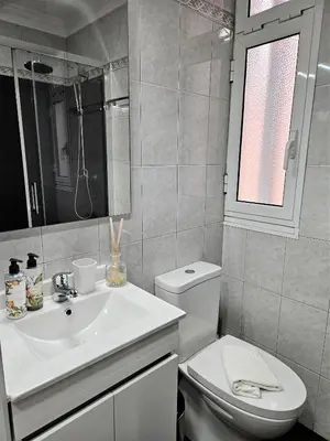a white bathroom with a sink and a toilet at Funchal Old Town Flat 1 in Funchal