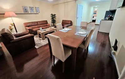 a living room with a dining room table and a couch at Funchal Old Town Flat 1 in Funchal