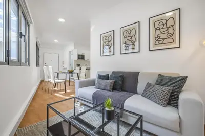 a living room with a couch and a table at Funchal Central Loft by Homie in Funchal