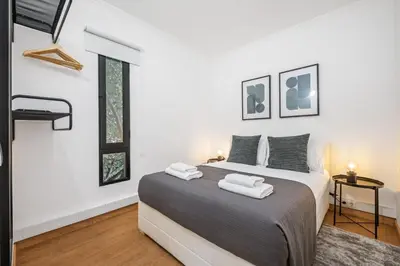 a bedroom with a bed with two towels on it at Funchal Central Loft by Homie in Funchal