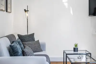 a living room with a couch and a table at Funchal Central Loft by Homie in Funchal