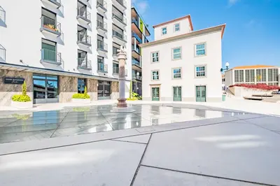 an empty courtyard with buildings in the background at Exclusive Terrace Apartment at Savoy Insular in Funchal