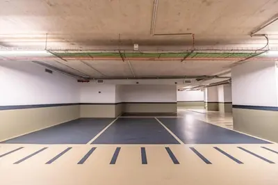 an empty room with a basketball court in a building at Exclusive Terrace Apartment at Savoy Insular in Funchal