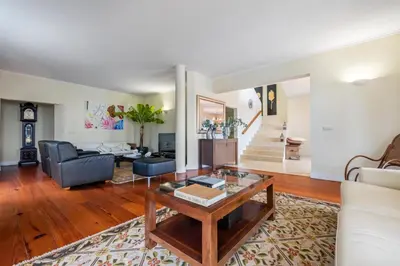 a living room with a couch and a table at Villa Magnólia in Funchal