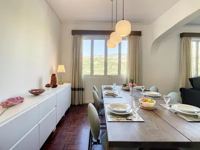 a dining room with a long table and chairs at Casa Santa Rita by Atlantic Holiday in Funchal