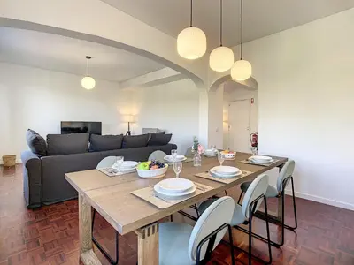 a dining room with a table and a couch at Casa Santa Rita by Atlantic Holiday in Funchal