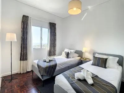 a bedroom with two beds and a window at Casa Santa Rita by Atlantic Holiday in Funchal