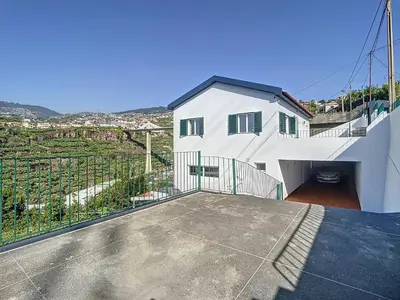 a white house with a balcony with a view at Casa Santa Rita by Atlantic Holiday in Funchal