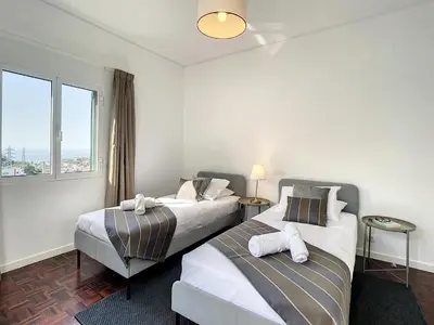 two beds in a hotel room with a window at Casa Santa Rita by Atlantic Holiday in Funchal