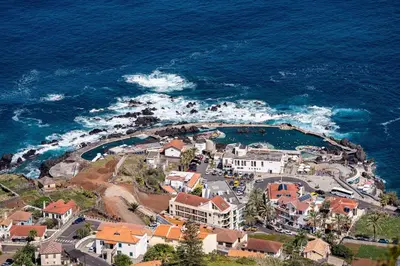 an aerial view of a resort on the ocean at Villa Rosa in Porto Moniz