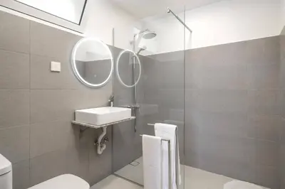 a bathroom with a sink and a mirror at Villa Sea Shore by Villa Plus in Gaula